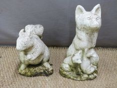 Garden model of three foxes together with a similar squirrel