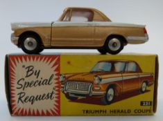 Corgi Toys dicast model Triumph Herald Coupe with bronze and white body and red interior 231, in
