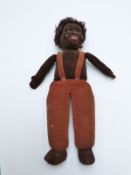 Norah Wellings vintage doll with brown felt body, glass eyes and brown curly hair, 37cm tall