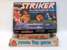 Four vintage games comprising Monopoly Star Trek The Next Generation Collectors Edition, Striker,