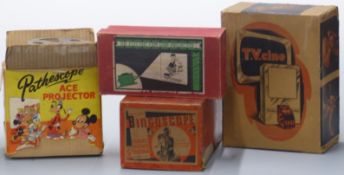 Four boxed cine or similar projectors comprising Bingoscope, Pathescope Ace, TV cine and an Electric