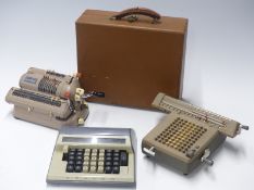 Three vintage mechanical calculators comprising Mentor, Contex and Monroe in case