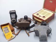 Vidor portable radio, Kodak six-20 folding Brownie camera, Zorki camera and a Mamiya DSX 1000 SLR