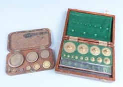 Two cased sets of weights, one Avery Ltd 8oz downwards, the other S.Garcia Ltd 10oz downwards,