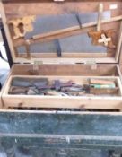 Large tool chest on feet and contents including saws, planes, pliers, chisels etc
