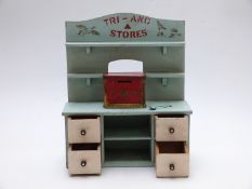 Tri-ang Stores miniature wooden shop display dresser with four drawers to base, 38 x 30.5cm
