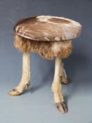 Taxidermy stool with three hoof feet and legs and deer skin top, H36cm