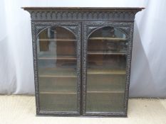 Victorian carved oak glazed bookcase with adjustable shelving, W153 x D45 x H155cm