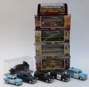 Four Corgi Classics diecast model trams together with a Corgi Original Omnibus Company coach, all in