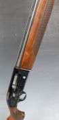 Beretta A303 12 bore semi-automatic shotgun with engraved locks, chequered semi-pistol grip,