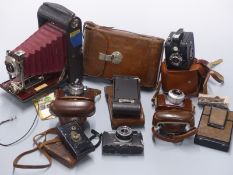 A collection of vintage cameras including large Kodak folding camera in leather case marked Major