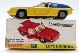 Dinky Toys diecast model Lotus Europa, with yellow body, blue roof and side panels, gold engine