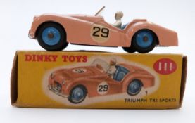 Dinky Toys diecast model Triumph TR2 Sports with salmon body, blue interior and white driver 111, in
