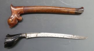 A Polynesian / Kris style dagger with sheath. Blade length 22cm.
