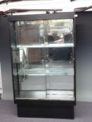 Double sided shop fitting or haberdashery cabinet with sliding doors, adjustable shelves and