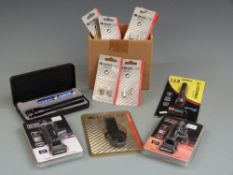 A cased mini Maglite together with two tracer L.E.D Headlights, Leatherman L.E.D flashlight, Maglite