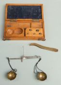 Oak cased travelling diamond scales with weights to interior of box and tweezers to side, width 15cm