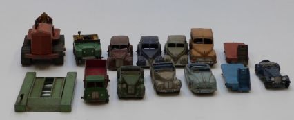 Fourteen Dinky Toys diecast model vehicles including cars, tractors, lorries etc