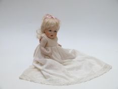 JDK Kestner bisque headed doll with open mouth, fixed blue eyes, blonde hair and jointed composite