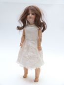 Armand Marseille bisque headed doll with open mouth, weighted blue eyes, long brown hair and