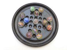 Thirteen handmade glass marbles all with multi-coloured latticino and spiralling decoration, each