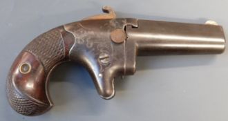 Colt No. 2 .41 rimfire derringer pistol with shaped and chequered grip, engraved decoration,