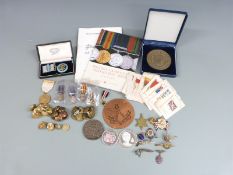 A collection of militaria to include buttons, RAF & Navy, Regimental enamel badges, Somerset Light