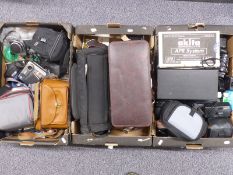 Large quantity of cameras and accessories including Praktica LTL SLR camera, Ricoh 500G, Polaroid,