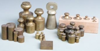 Approximately 30 mainly cylindrical brass weights, many with GR  cipher, 10oz troy to 1oz troy run