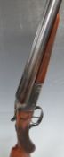 BSA 12 bore side by side shotgun with engraved locks, chequered semi-pistol grip and forend,