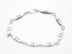 Georg Jensen bracelet made up of oval links with line decoration, designed by Lene Munthe