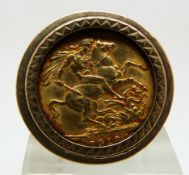 A 9ct gold ring set with a 1913 gold full sovereign, 18.1g (size X)