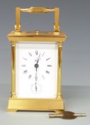 Dent of London 20thC brass carriage clock, with reeded pillars to corners, enamelled Roman dial with