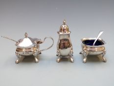 Elizabeth II hallmarked silver three piece cruet set with blue glass liners, Sheffield 1973 maker