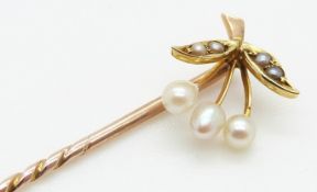 A 9ct gold stick pin set with pearls and seed pearls, 1g