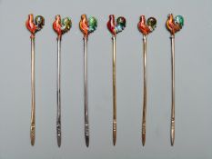 Six hallmarked and enamelled cockerel cocktail sticks, various dates but all Adie Brothers Ltd,