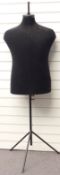 A vintage tailor's dummy raised on a black metal stand, height 161cm