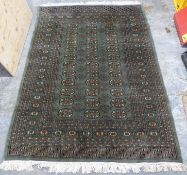 Small rug with green ground