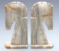 Pair of carved stone Art Deco style bookends in the form of horses, height 27cm
