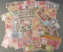Over 100 African and Asian/Oriental banknotes including Victoria, Cambodia, Chinese hell notes,