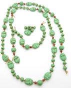 A ceramic necklace made up of scarab beetle beads