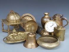 A collection of brassware including Arts and Crafts hammered caddy, globe, fire extinguisher,