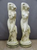 Pair of garden statues of ladies with their arms above their heads, height 86cm