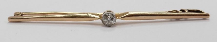 A 9ct gold bar brooch set with an old cut diamond measuring approximately 0.2ct