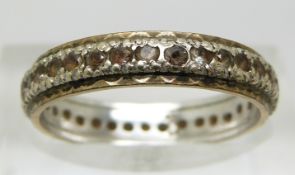 A 9ct gold eternity ring set with paste, 2.6g (size N)