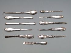 Eleven various early 20th century hallmarked silver dressing table and similar tools, length of