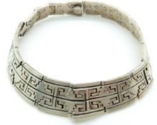 A large silver collar necklace with Greek key design to the articulated links, 240g