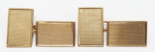 A pair of 9ct gold engine turned cufflinks, 3.7g