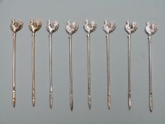 Eight hallmarked and enamelled cockerel cocktail sticks, two being gilt, various dates but all