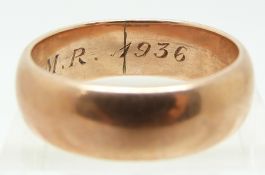 A 9ct rose gold wedding band dated 1936, 9.4g (size W)